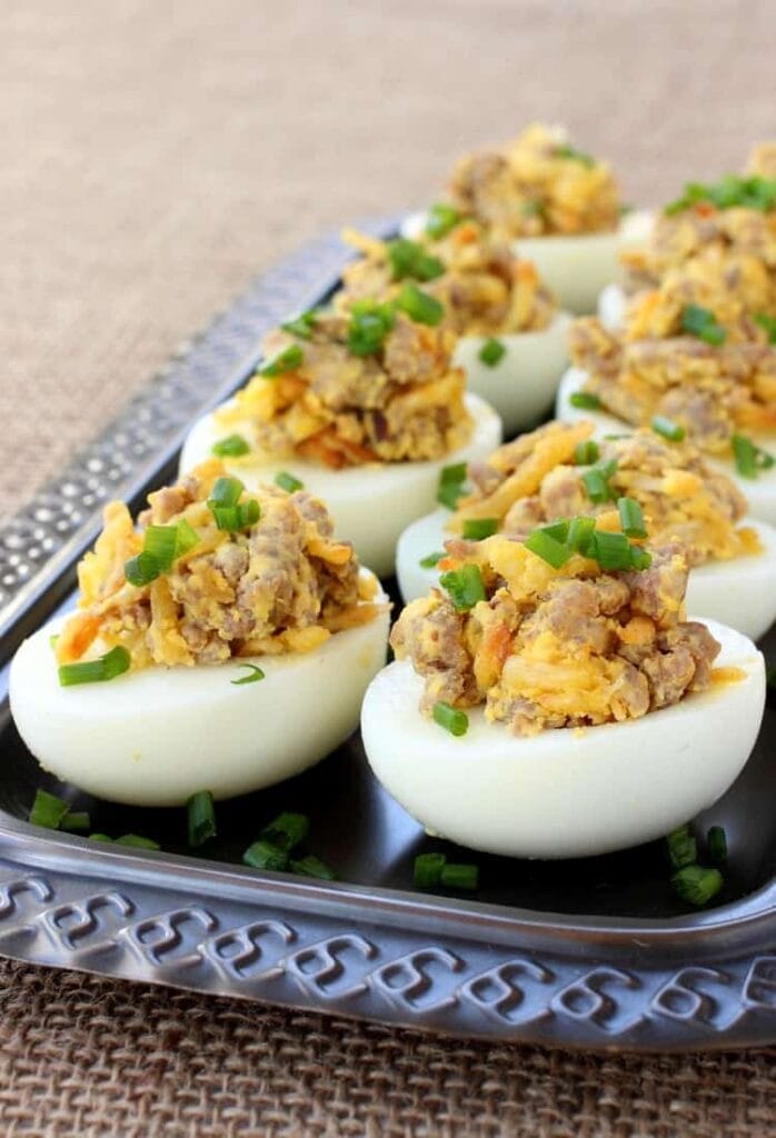 These Sausage and Hash Brown Deviled Eggs are the ultimate guy food - sausage, potatoes and eggs in one bite!