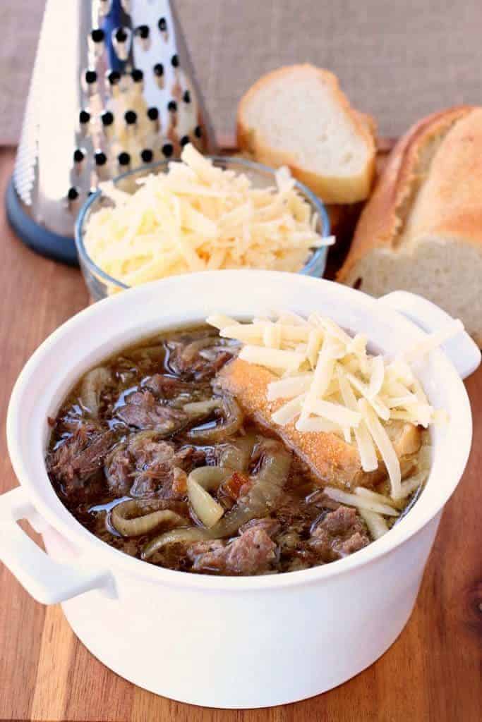 Slow Cooker Beefy French Onion Soup gets topped with bread and gruyere cheese then baked!