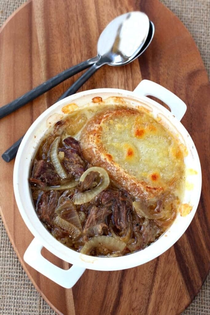 This Slow Cooker Beefy French Onion Soup is the best version of French Onion soup ever!
