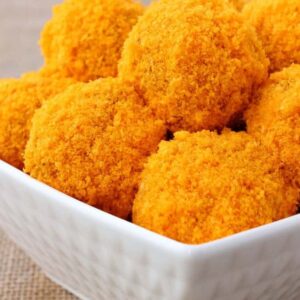 Stuffed Cheese Doodle Meatballs are coated in a cheese doodle crust!