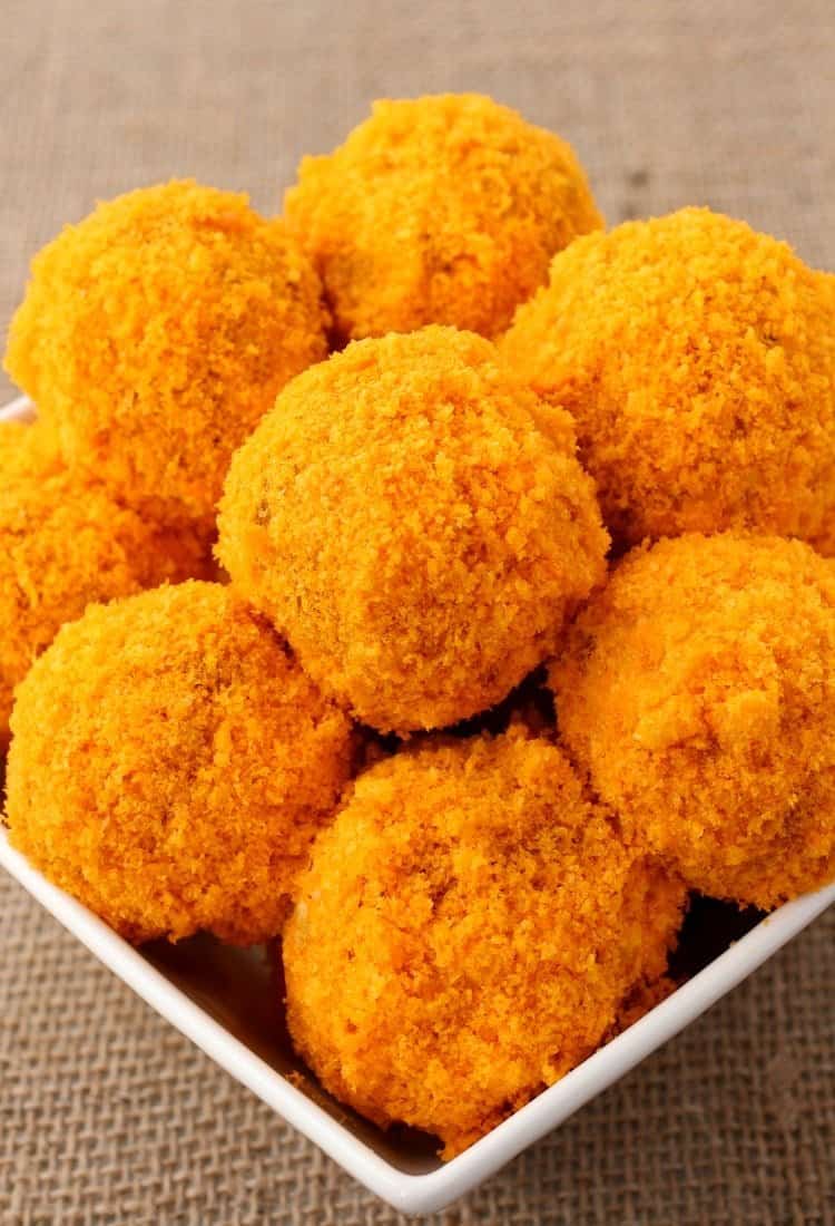 Cheese Doodle Chicken Meatballs are the ultimate party food! Chicken meatballs, stuffed with cheese and bacon with a crunchy cheesy crust! Cheese Doodle Chicken Meatballs are the ultimate kid party food!