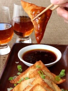 Whiskey Glazed Fried Dumplings are crispy wontons dipped in an addictive whiskey glaze!