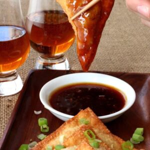 Whiskey Glazed Fried Dumplings are crispy wontons dipped in an addictive whiskey glaze!