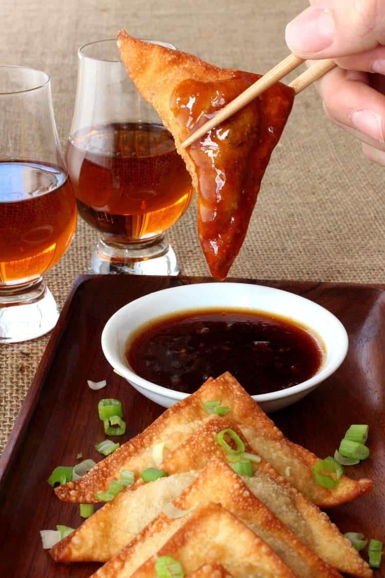 Whiskey Glazed Fried Dumplings are crispy wontons dipped in an addictive whiskey glaze!