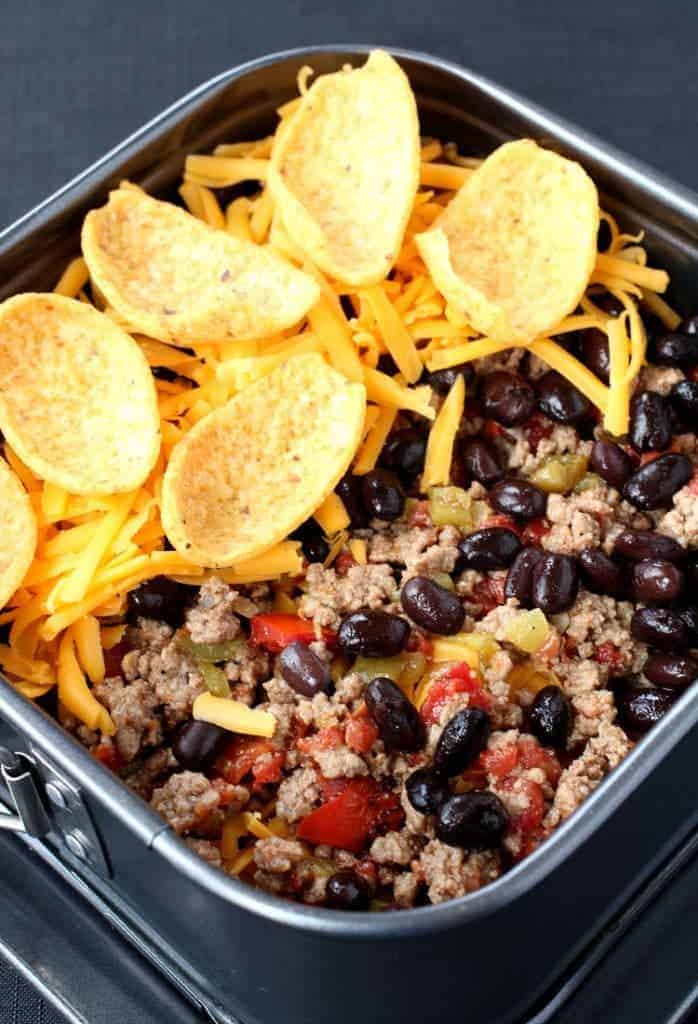 Layer these Trashcan Frito Nachos in a springform pan to make getting them out a breeze!