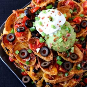 Trashcan Frito Nachos have layers of meat, cheese, fritos and ALL the toppings in every bite!