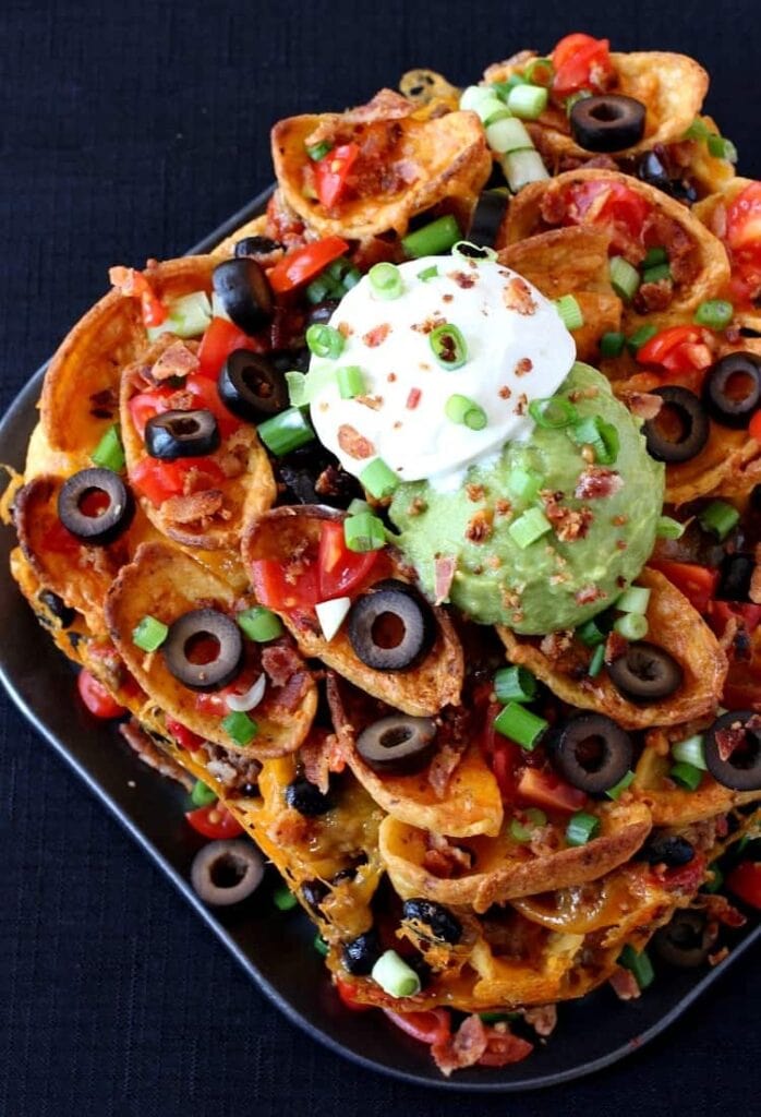 Trashcan Frito Nachos have layers of meat, cheese, fritos and ALL the toppings in every bite!