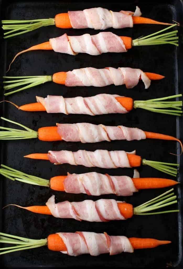 Bacon Wrapped Maple Glazed Carrots roast in the oven before glazing!