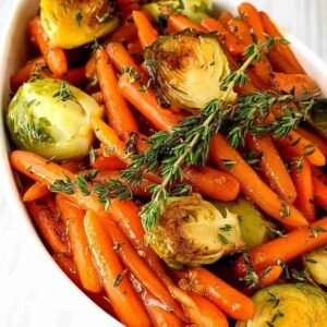 brussels sprouts and carrots with fresh thyme on top