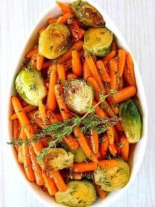 brussels sprouts and carrots in a white dish