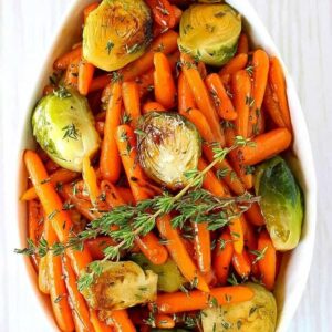 brussels sprouts and carrots in a white dish