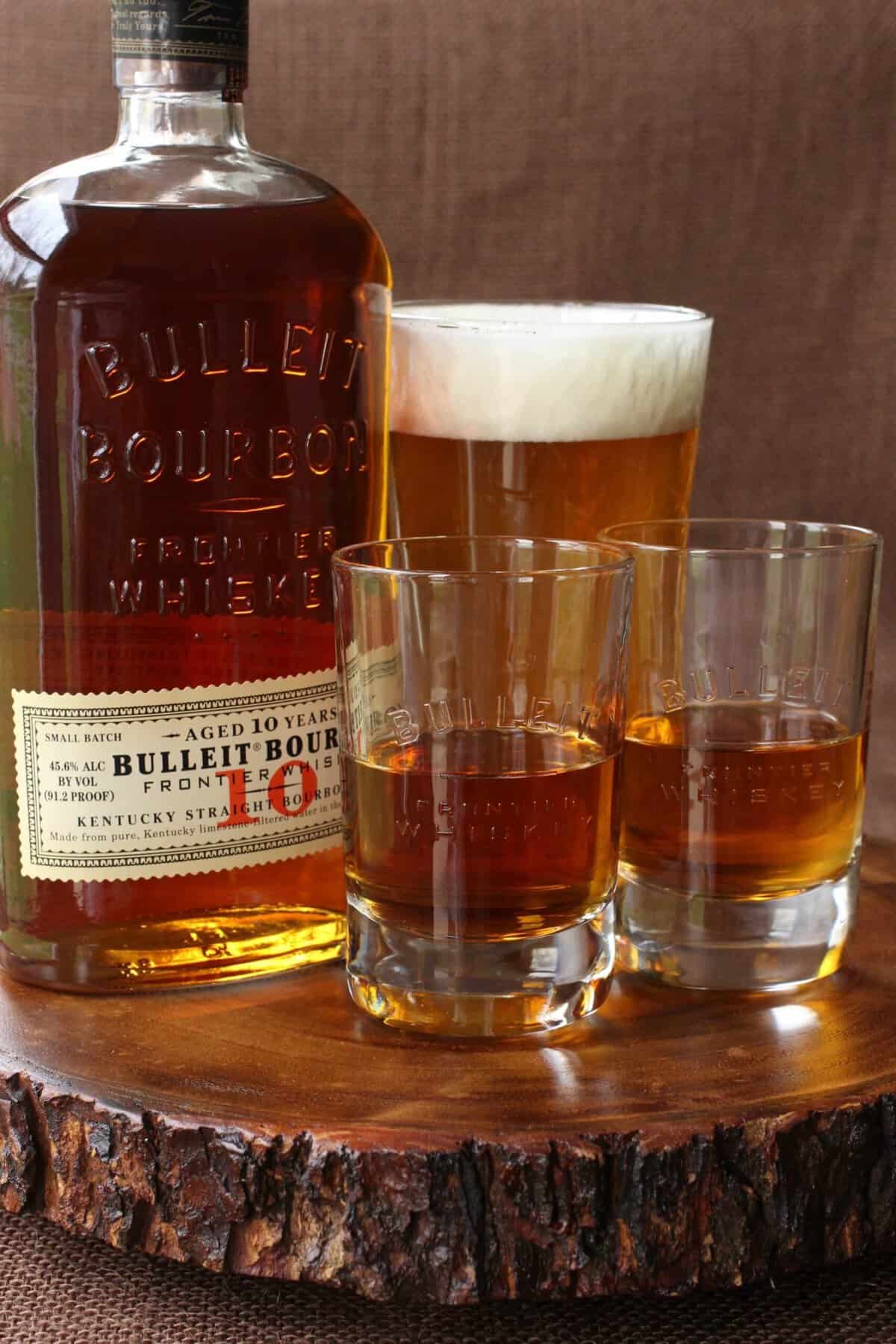 This fun Boilermaker Drink is a happy hour classic. A simple cocktail served with a glass of beer and a shot of whiskey on the side! This Aged Frontier Farmhouse Boilermaker is the perfect combination for aged bourbon!