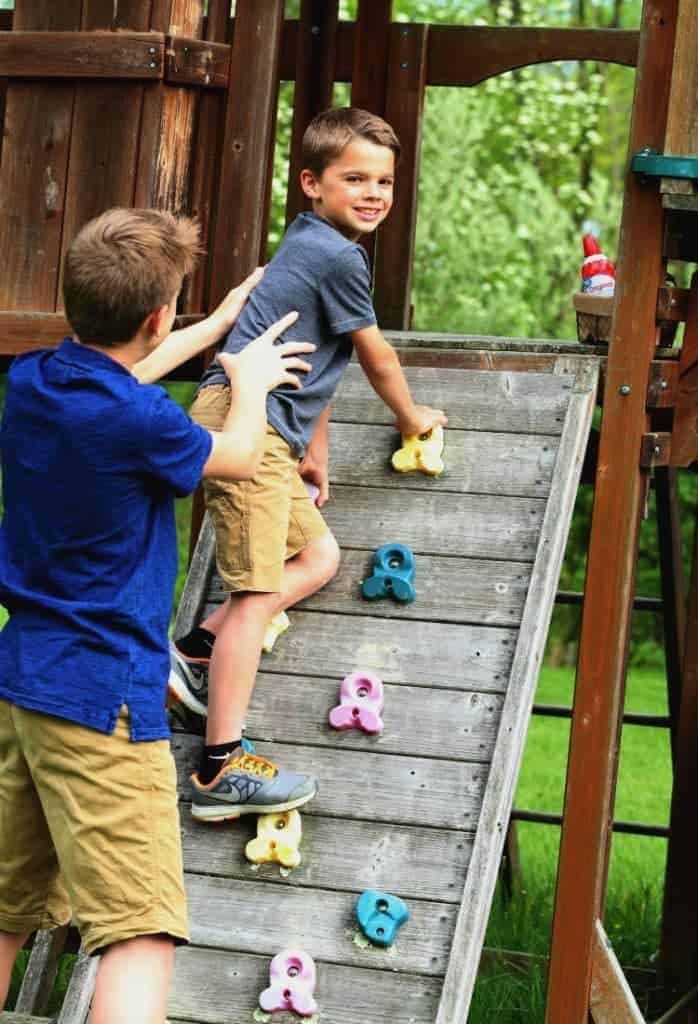 kids climbing on swing set