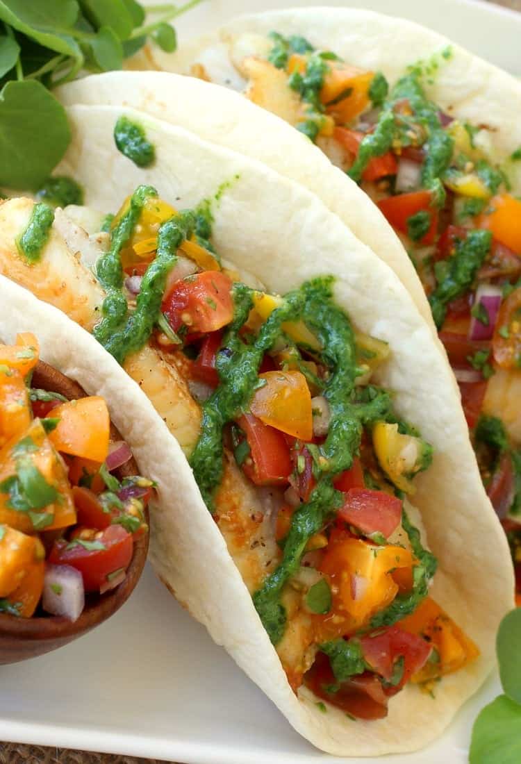 These Cinco de Mayo Recipes are going to make your party memorable. Fun dinner ideas that are totally on theme and so delicious! Fish Tacos with Tomato Salsa and Fresh Watercress Sauce are not only delicious but super healthy too!