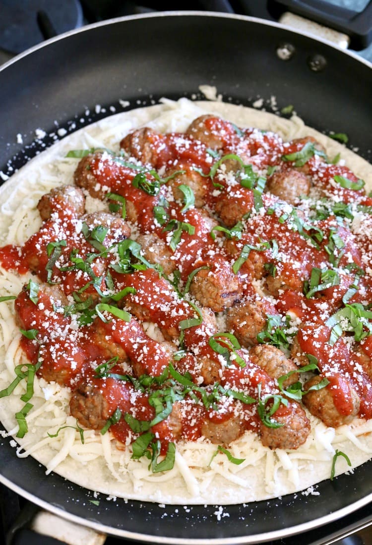 meatballs on a tortilla with sauce for making quesadillas