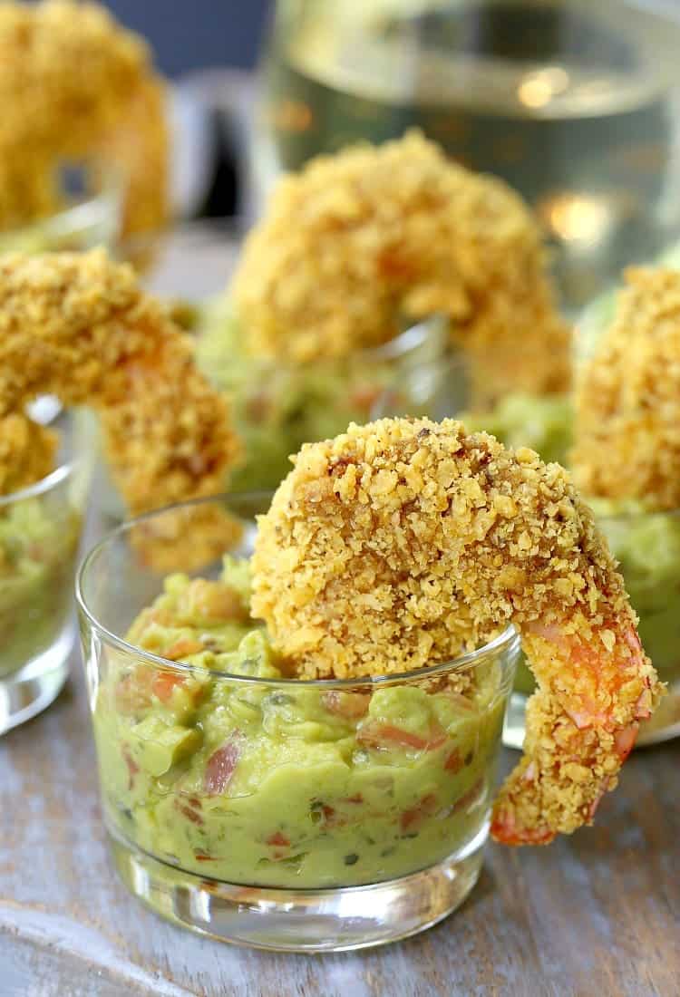 Crunchy Tortilla Shrimp are fun for a tapas night or happy hour! Jumbo shrimp breaded in crushed tortilla chips and baked until crispy! Make these Tortilla Crusted Taco Shrimp for your next happy hour!