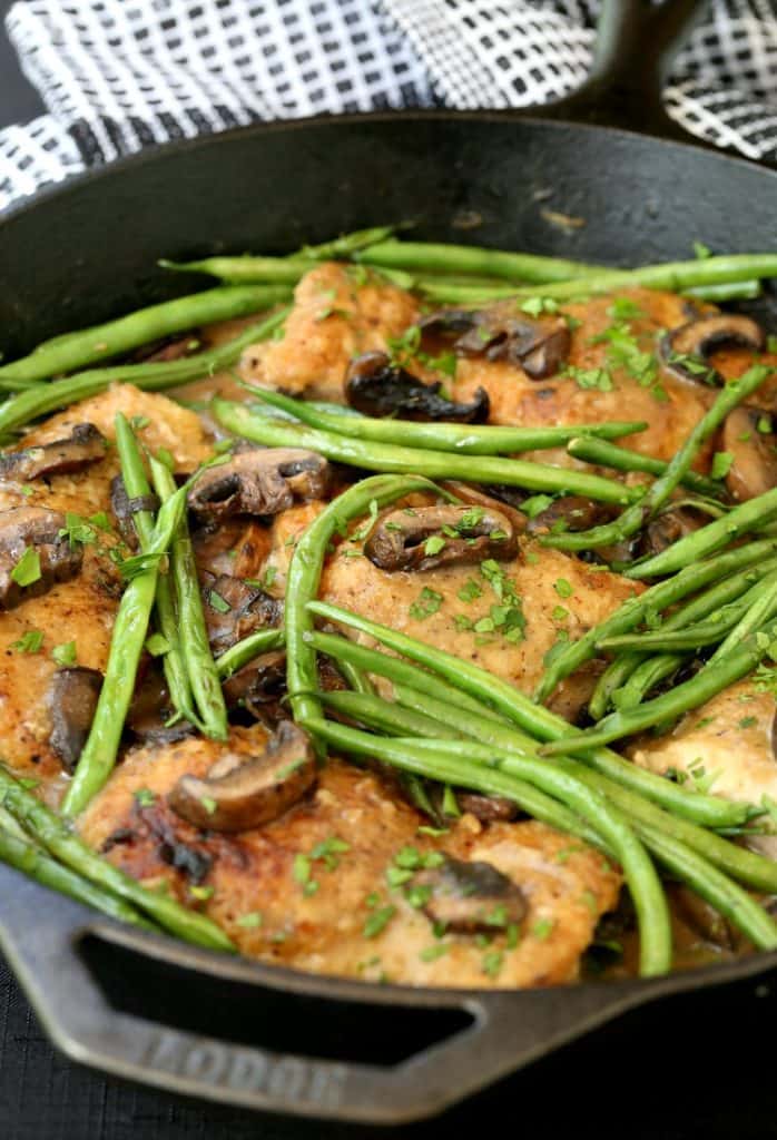 Braised Chicken Thighs and Green Beans in a skillet