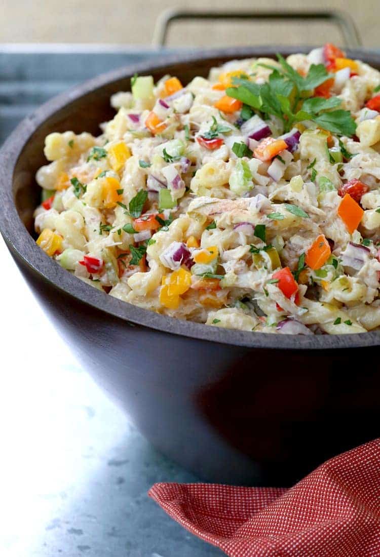 This Crab Pasta Salad is loaded with crab meat and tons of vegetables! All the flavors of a crab cake tossed with pasta and a tangy dressing! Crab Cake Pasta Salad is a pasta salad recipe that can be a side dish or the main course