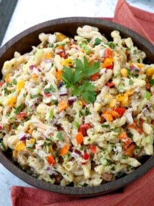 pasta salad with crab and vegetables in bowl