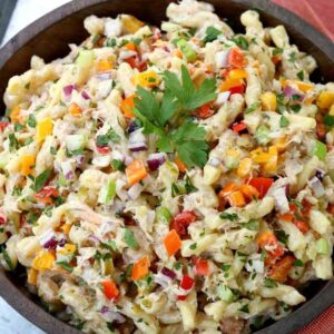 pasta salad with crab and vegetables in bowl