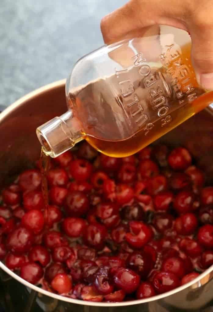 Pour in a good amount of bourbon to make this bourbon cherry pie filling!