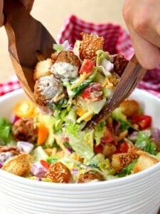 Cheeseburger Salad with tongs