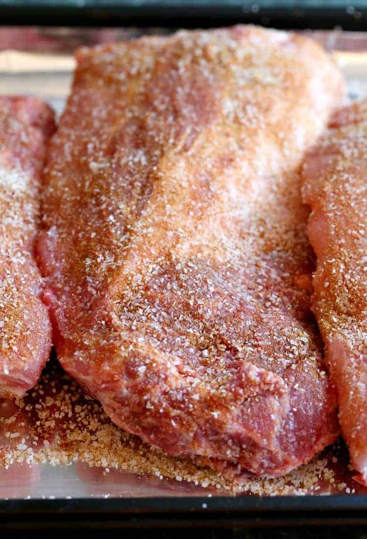Root Beer BBQ Ribs are crazy addicting and coated in a sweet homemade root beer barbecue sauce. An easy to make, make ahead dinner recipe! Sticky Root Beer BBQ Ribs start with a dry rub before going in the oven.