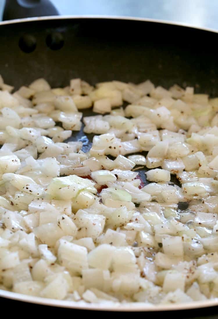 Caramelized Onion Chicken Salad is sweet and creamy with a bit of crunch! Sweet, caramelized onions takes this chicken salad over the top! Caramelized Onions Chicken Salad, onions in a skillet cooking