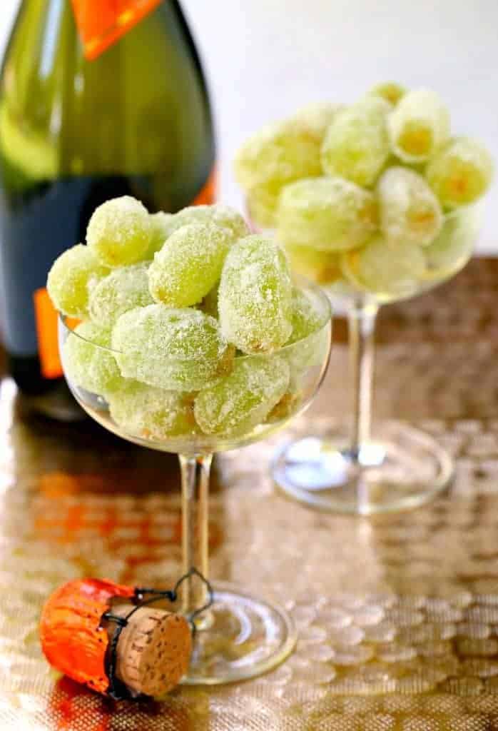 Kick up your New Year's Eve food with these Sugared Prosecco Grapes! A three ingredient, boozy dessert that's perfect for your New Year's celebration! #newyears #boozydessert