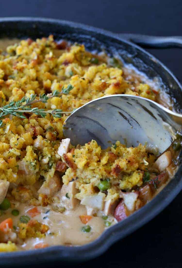 Skillet Chicken Pot Pie with serving spoon