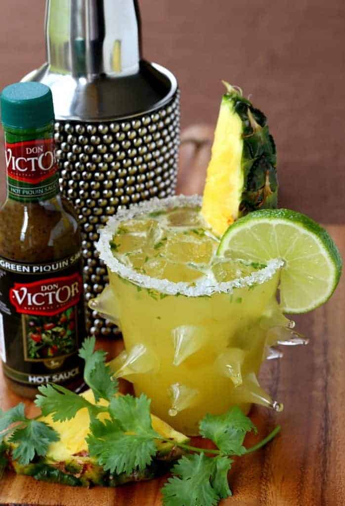 This Spicy Pineapple Cilantro Margarita is a tequila cocktail made with fresh pineapple and hot sauce