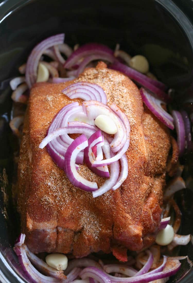 This Pulled Pork Recipe is cooked in a slow cooker or crock pot until tender