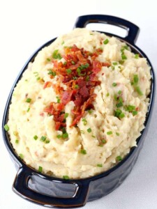 These Slow Cooker Cheesy Bacon Mashed Potatoes are so cheesy and so creamy, you'll be making them over and over!