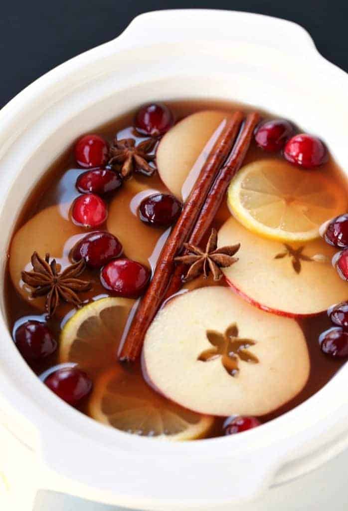 Ingredients for spiked cider cocktail in crock pot