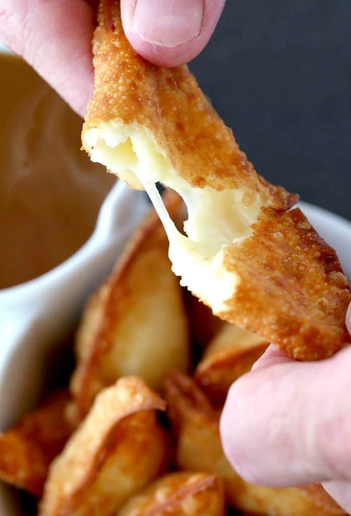 These Fried Poutine Wontons have a super cheesy center, surrounded by fluffy leftover mashed potatoes
