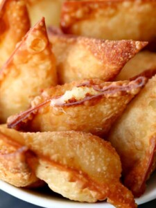 These Fried Poutine Wontons get dipped in brown gravy, just like poutine!