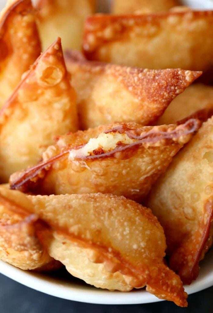 These Fried Poutine Wontons are a fried wonton recipe that are filled with mashed potatoes and cheese