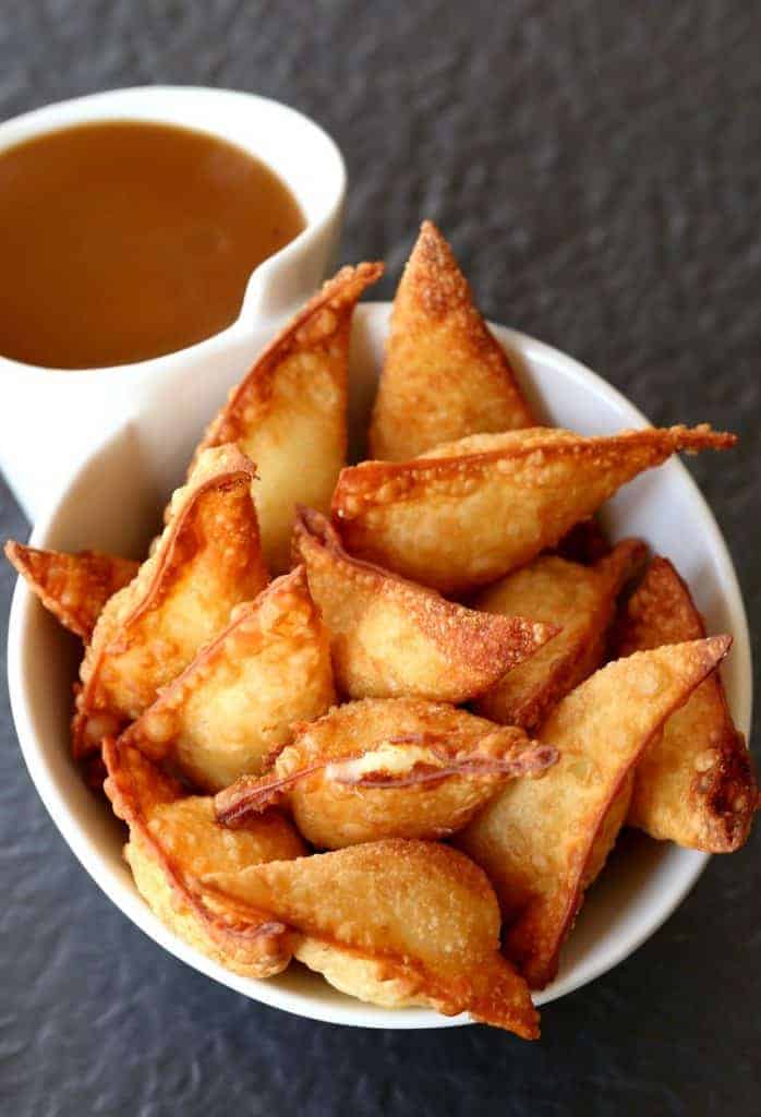 These Fried Poutine Wontons are an appetizer recipe that can be made with leftover mashed potatoes