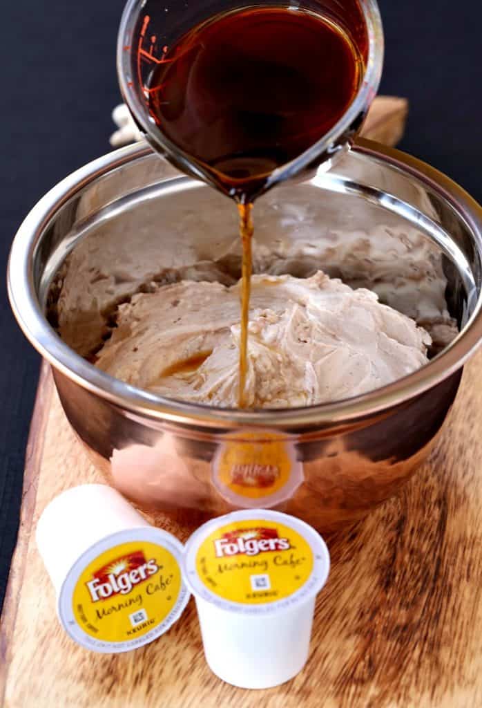 coffee pouring into cream cheese in a bowl