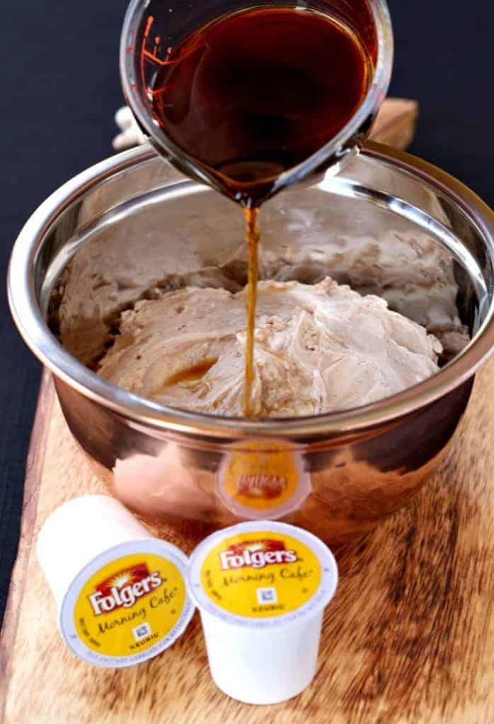 coffee pouring into cream cheese in a bowl