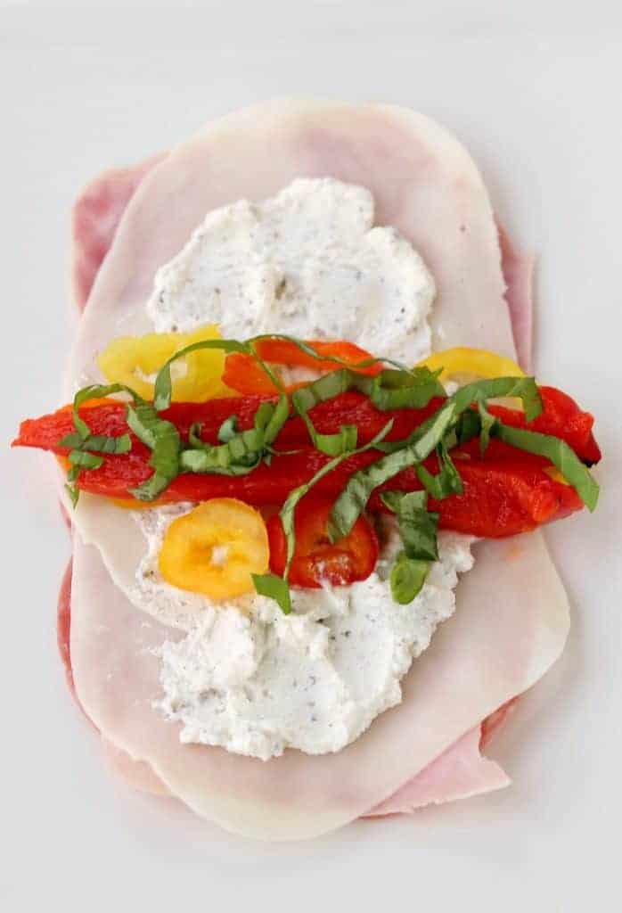 Italian Deli Roll Ups open on plate showing peppers and cheese