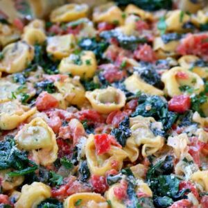 Skillet Tuscan Spinach Tortellini in skillet from side