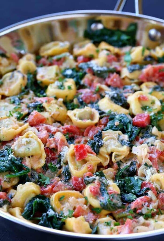 Skillet Tuscan Spinach Tortellini in skillet from side