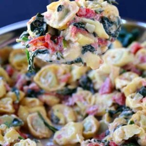 Skillet Tuscan Spinach Tortellini on a big spoon
