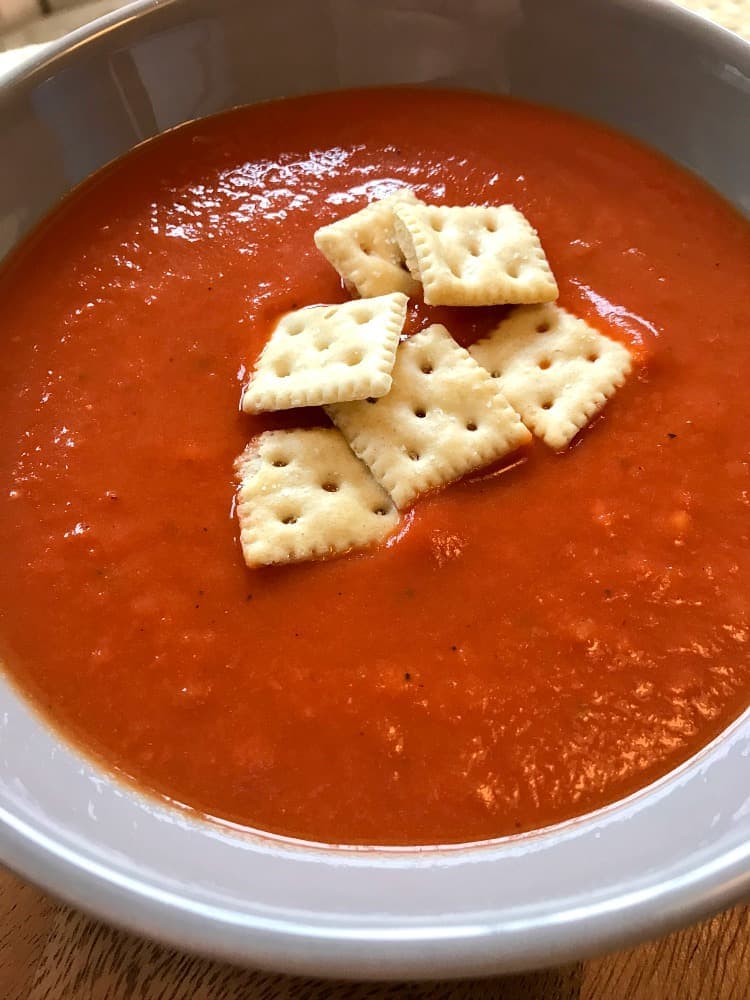 Tomato Soup with crackers in a bowl