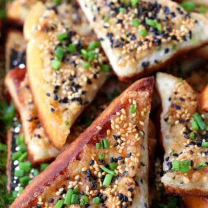 Bacon Shrimp Toast stacked on a plate