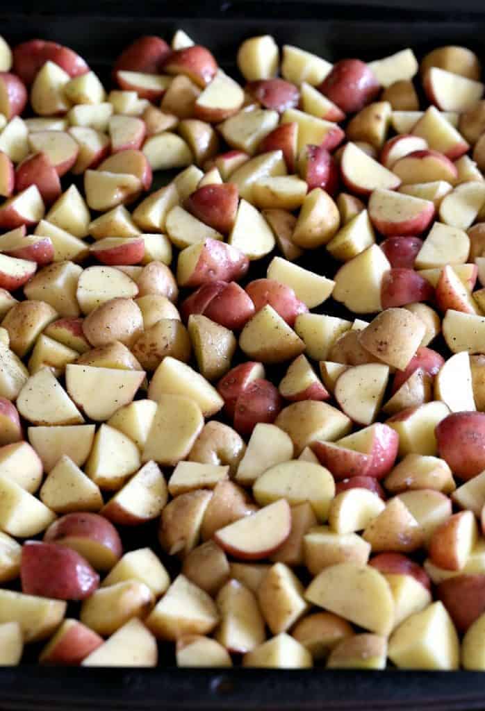 diced potatoes on baking sheet