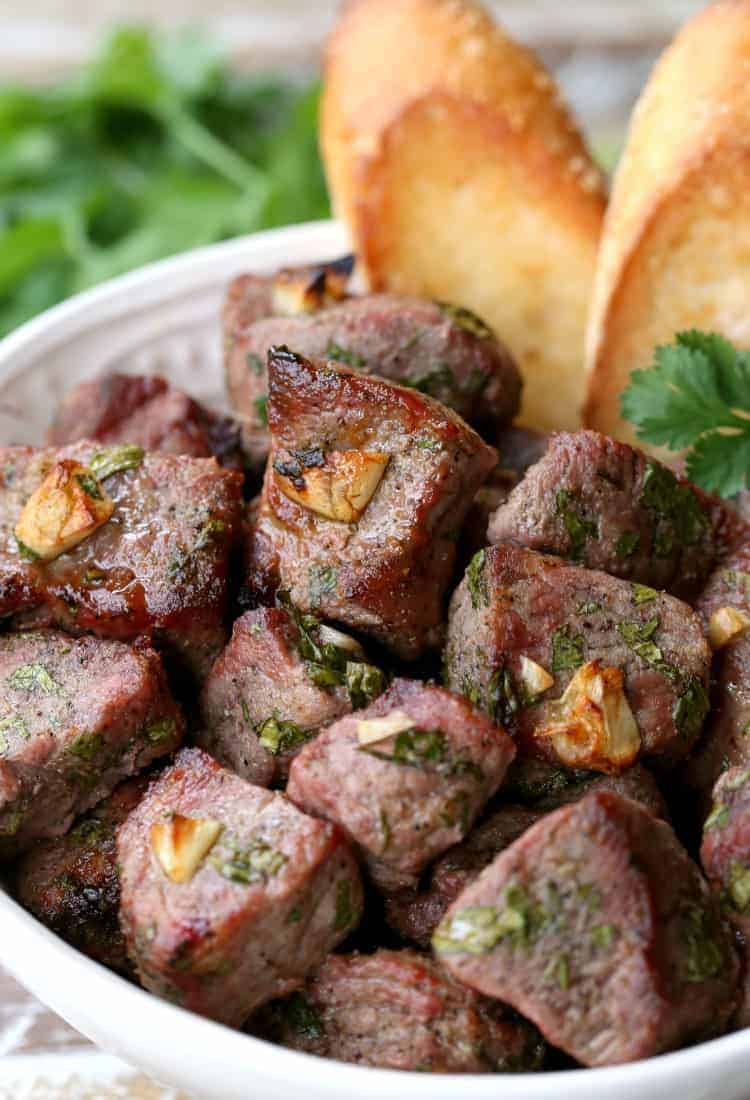 Fiesta Steak Tips in a bowl with bread