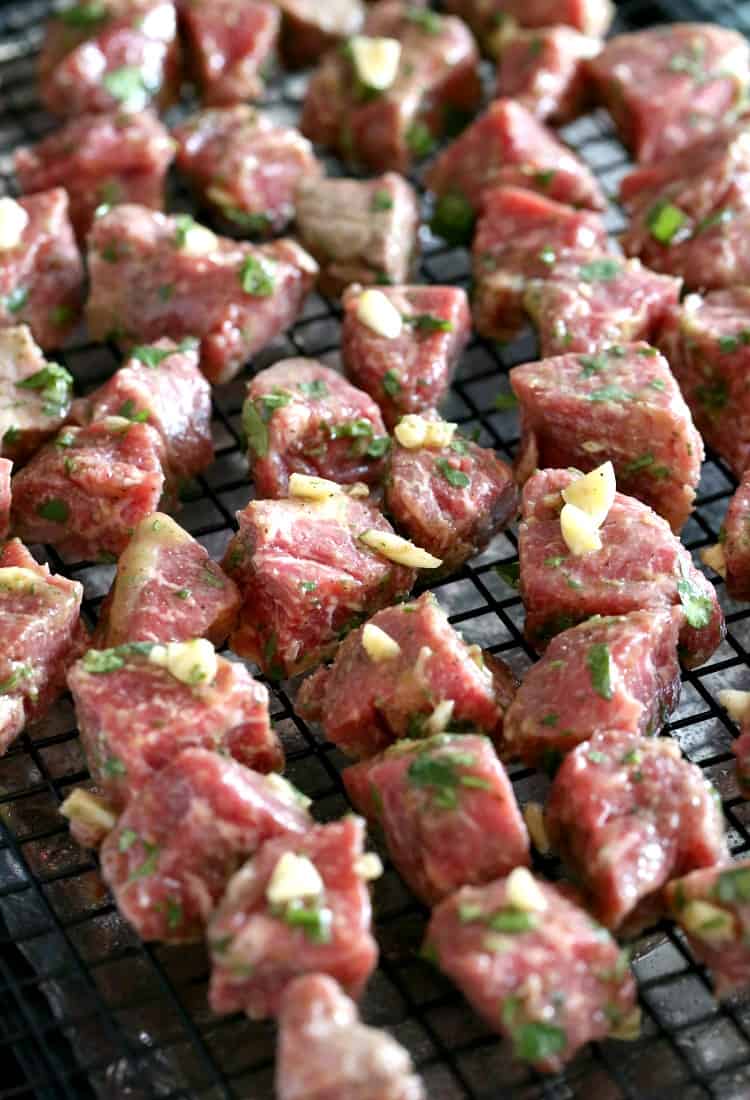Fiesta Steak Tips on a rack going into the oven