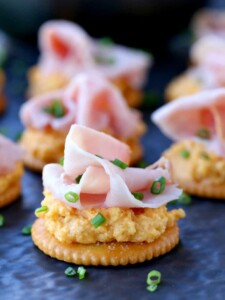 Ham and Pub Cheese Crackers close up on slate